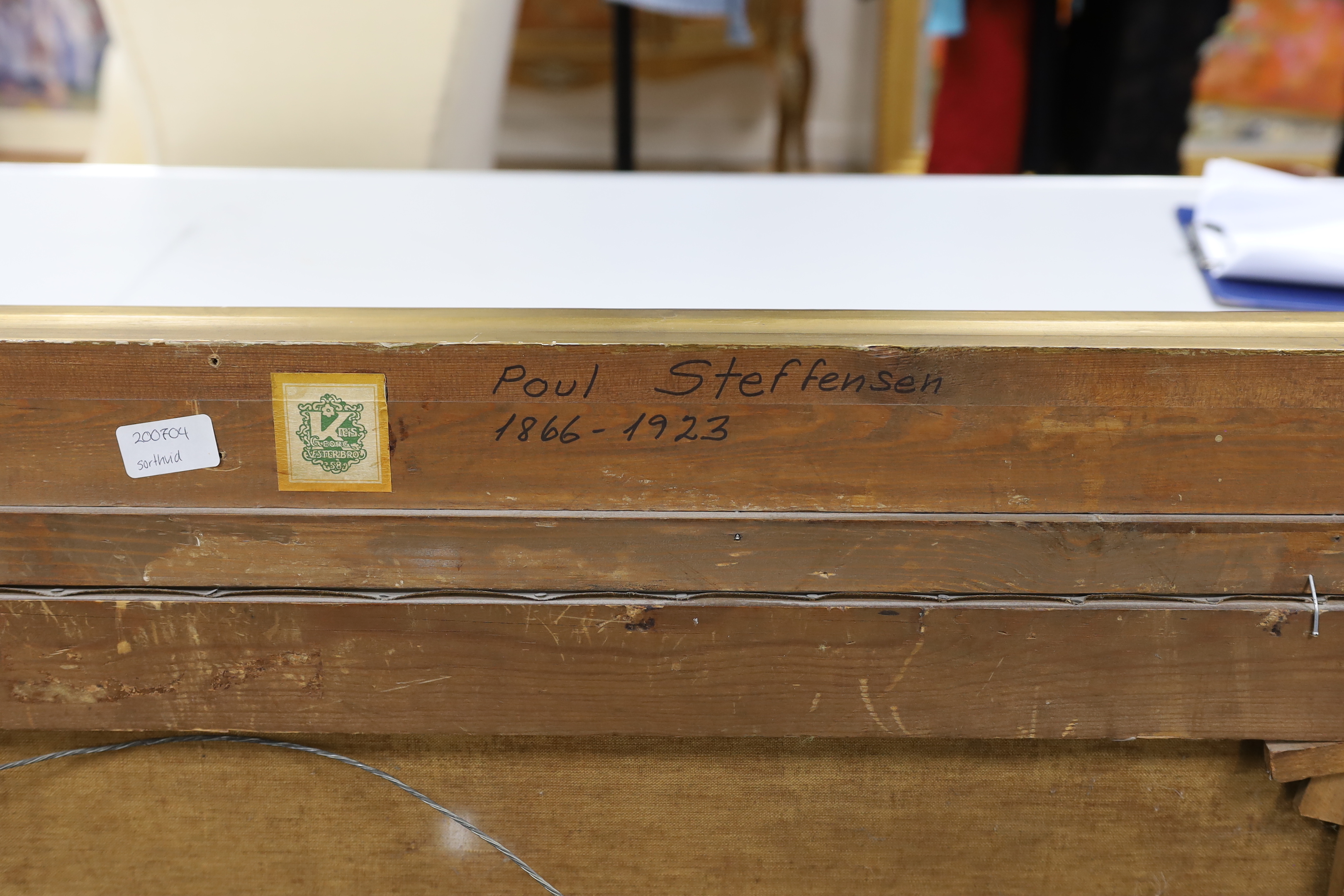 Poul Steffensen (1866-1923), oil on canvas, Cattle grazing before hayricks, signed and indistinctly dated, 63 x 102cm